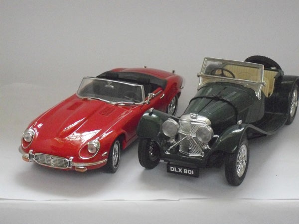 Two model cars on a white background.