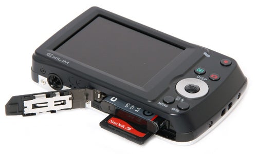 Casio Exilim EX-Z33 camera with open battery compartment.