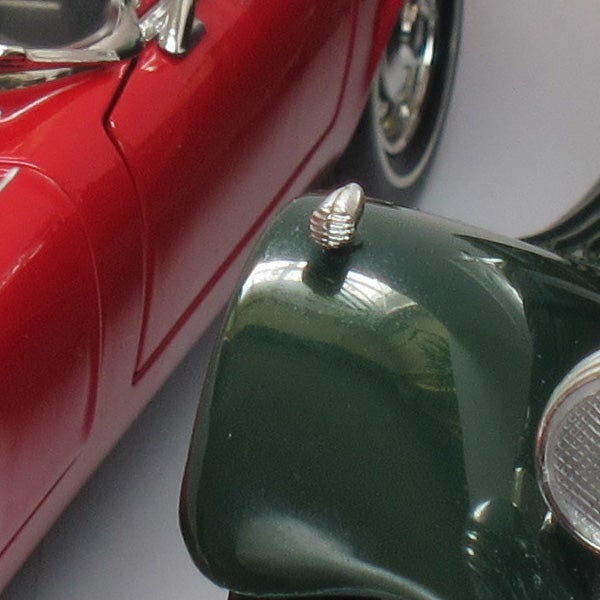 Close-up photo of red and green toy cars
