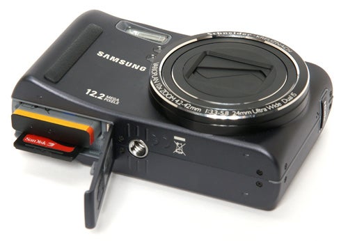 Samsung WB550 camera with memory card slot open.