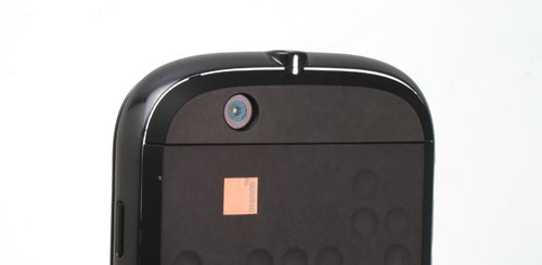 Close-up of Motorola Dext smartphone camera and textured back panel.