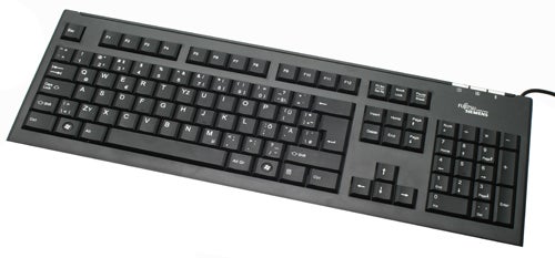Fujitsu branded wired keyboard on white background.