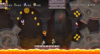 Screenshot of New Super Mario Bros Wii gameplay with four players.