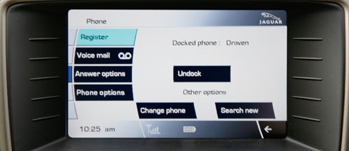 Jaguar XKR Coupe infotainment display with phone connectivity options.
