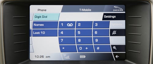 Jaguar XKR Coupe's infotainment system touchscreen displaying phone interface.