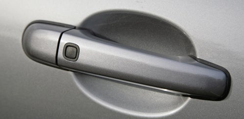 Close-up of a Jaguar XKR Coupe door handle.