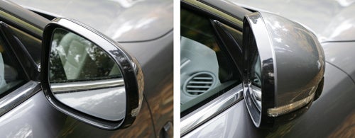 Jaguar XKR Coupe side mirror close-up view.