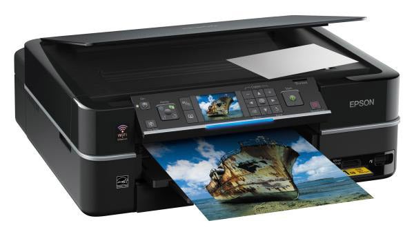 Epson Stylus Photo PX710W printer with printed photograph emerging.