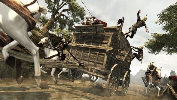 Action scene from Assassin's Creed II with horses and carriage.