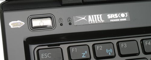 Close-up of Asus UL50Vg laptop keyboard and audio stickers.