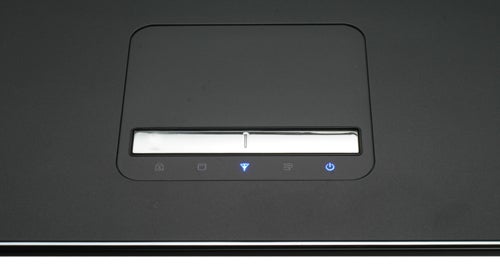 Close-up of Samsung X520 laptop touchpad and quick access buttons.