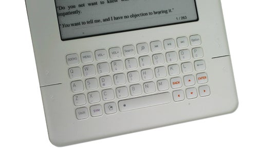 iRiver Story eBook Reader with keyboard and screen displaying text.