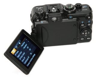 Canon PowerShot G11 camera with a flipped out LCD screen.