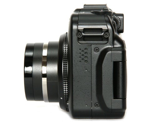Canon PowerShot G11 camera side view on white background.