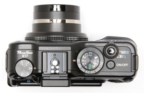 Canon PowerShot G11 camera top view displaying controls.