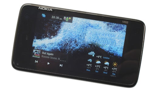 Nokia N900 smartphone displaying home screen on white background.