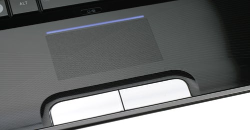 Close-up of Toshiba Satellite P500 laptop's touchpad and speakers.