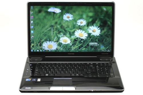 Toshiba Satellite P500-12D laptop with open screen displaying flowers.