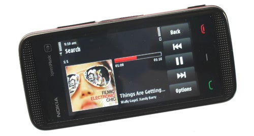 Nokia 5530 XpressMusic showing music player interface.