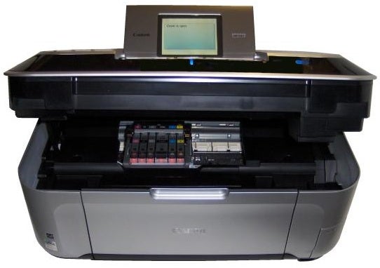Canon PIXMA MP990 printer with open scanning lid.