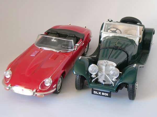 Model cars: red Jaguar E-Type and green Morgan Roadster.