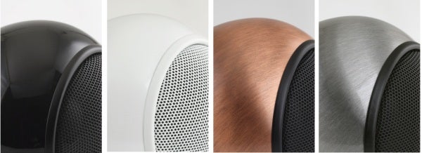 Four Orb Audio speakers in black, white, copper, and silver finishes.
