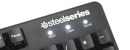 Close-up of SteelSeries 7G gaming keyboard with indicator lights.