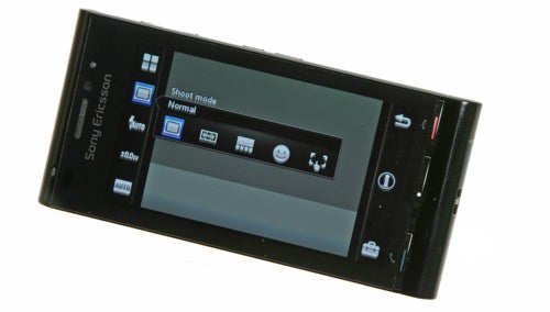 Sony Ericsson Satio U1i smartphone with camera interface displayed.