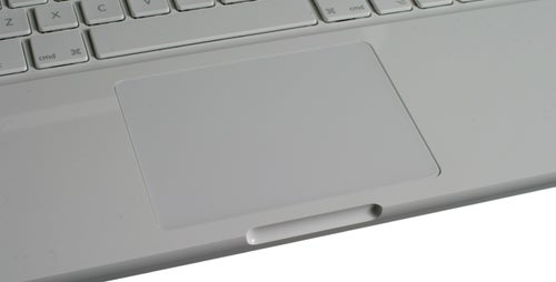 Close-up of 2009 Apple MacBook's keyboard and trackpad.