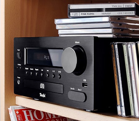 Teufel Impaq 40 Mini Stereo System on a bookshelf.