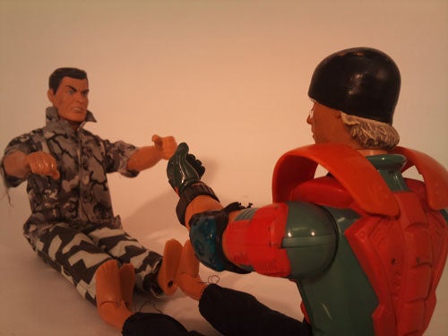 Action figures posed in a face-off scenario.