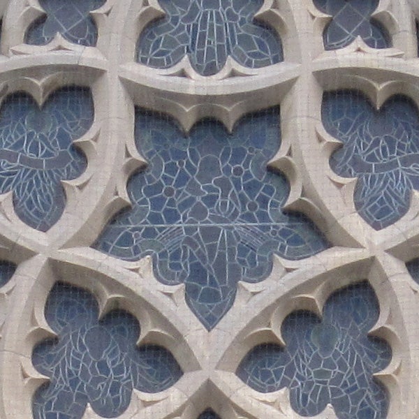 Close-up of intricate stone window tracery patterns.