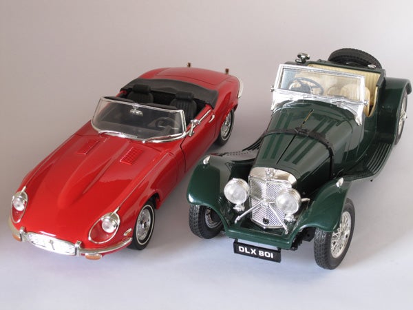 Photo of red and green vintage model cars
