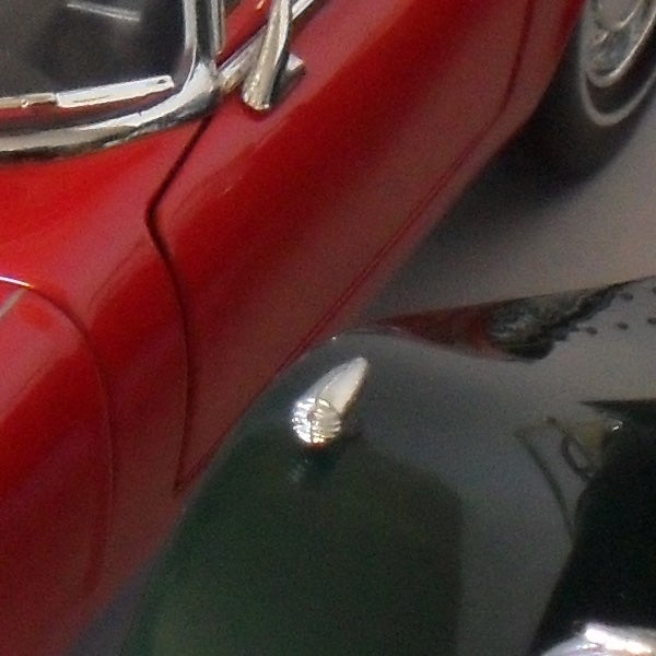 Close-up photo of a red vehicle captured with Samsung ST500.