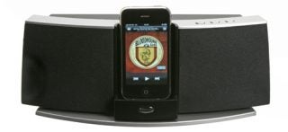 Klipsch iGroove SXT speaker dock with an iPhone displayed.