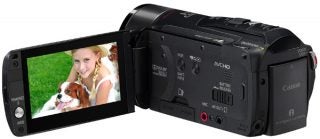 Canon Legria HF M31 camcorder with flip-out LCD screen.