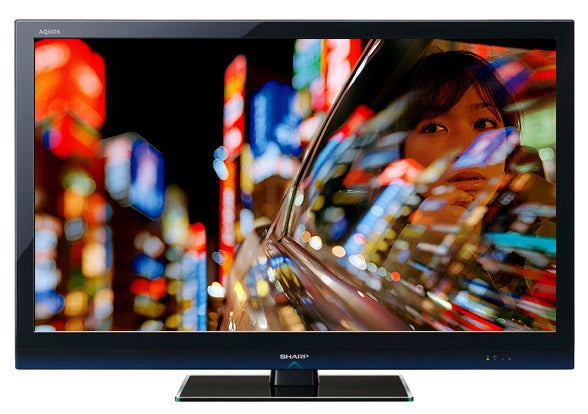 Sharp Aquos LC-40LE700E 40-inch LED TV displaying colorful cityscape.