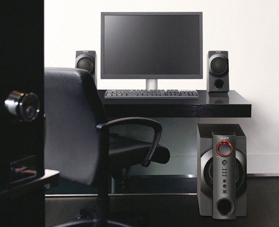 Sony SRS-DB500 PC speakers on a desk with computer setup.