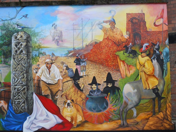 Colorful mural depicting historical and fantasy scenes.