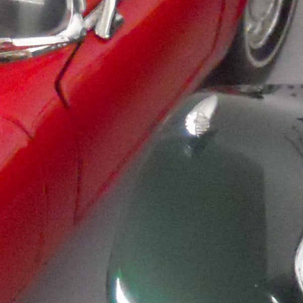 Close-up of a red Nikon Coolpix S570 camera