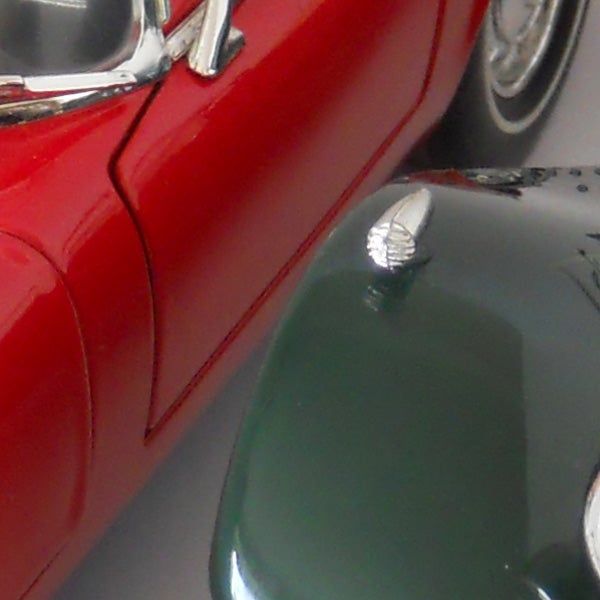 Close-up of vintage red car captured with Nikon S570.