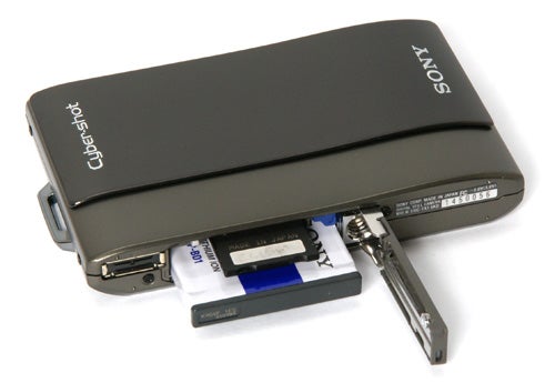 Sony Cyber-shot DSC-TX1 camera with open battery compartment