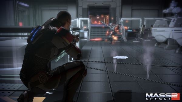 Mass Effect 2 gameplay showing a character in cover shooting.