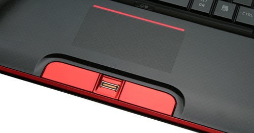 Close-up of Toshiba Qosmio X500-10T laptop's keyboard and touchpad.