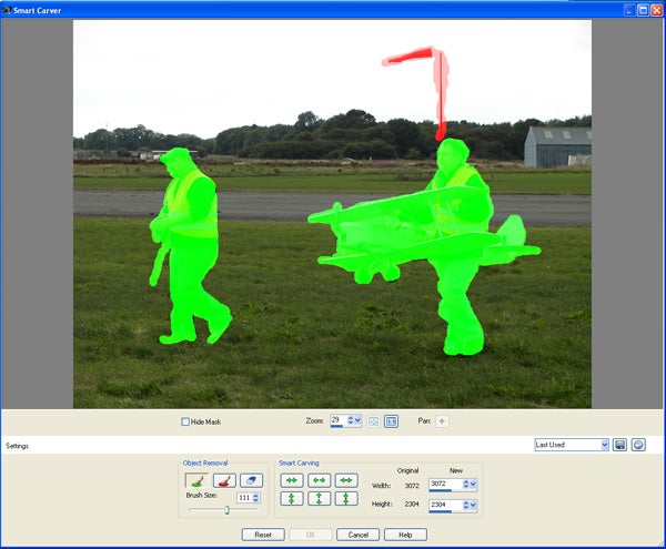 Two men carrying a model airplane across a grass field.Screenshot of Corel PaintShop Photo Pro X3 Smart Carver feature.