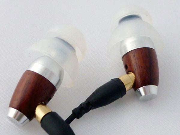 Sleek Audio SA1 earphones with wooden design and silicone tips.