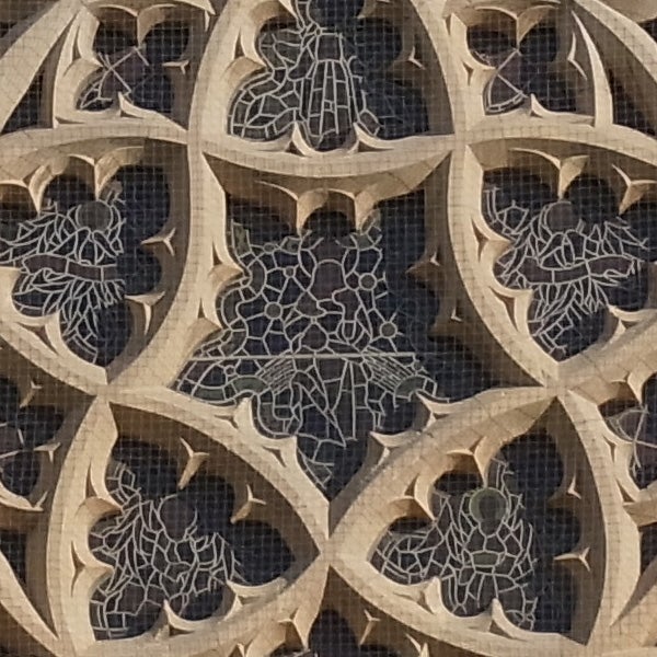 Detailed architectural stone tracery with intricate patterns.