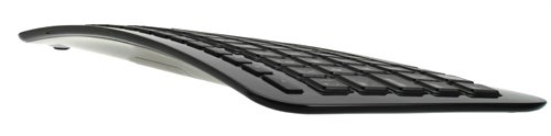 Side profile of a black Microsoft Arc Keyboard.