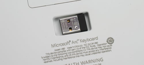 Close-up of Microsoft Arc Keyboard USB dongle and label