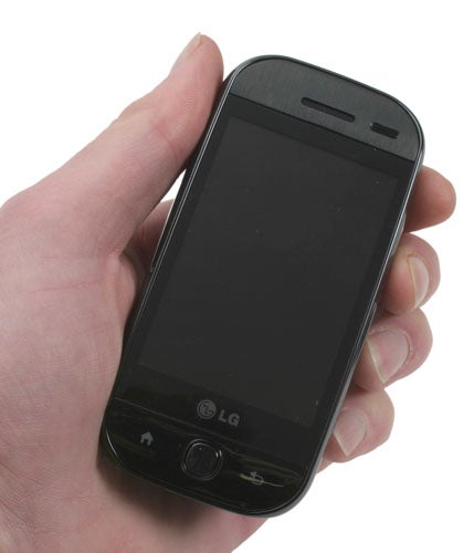 Hand holding LG GW620 InTouch Max smartphone.
